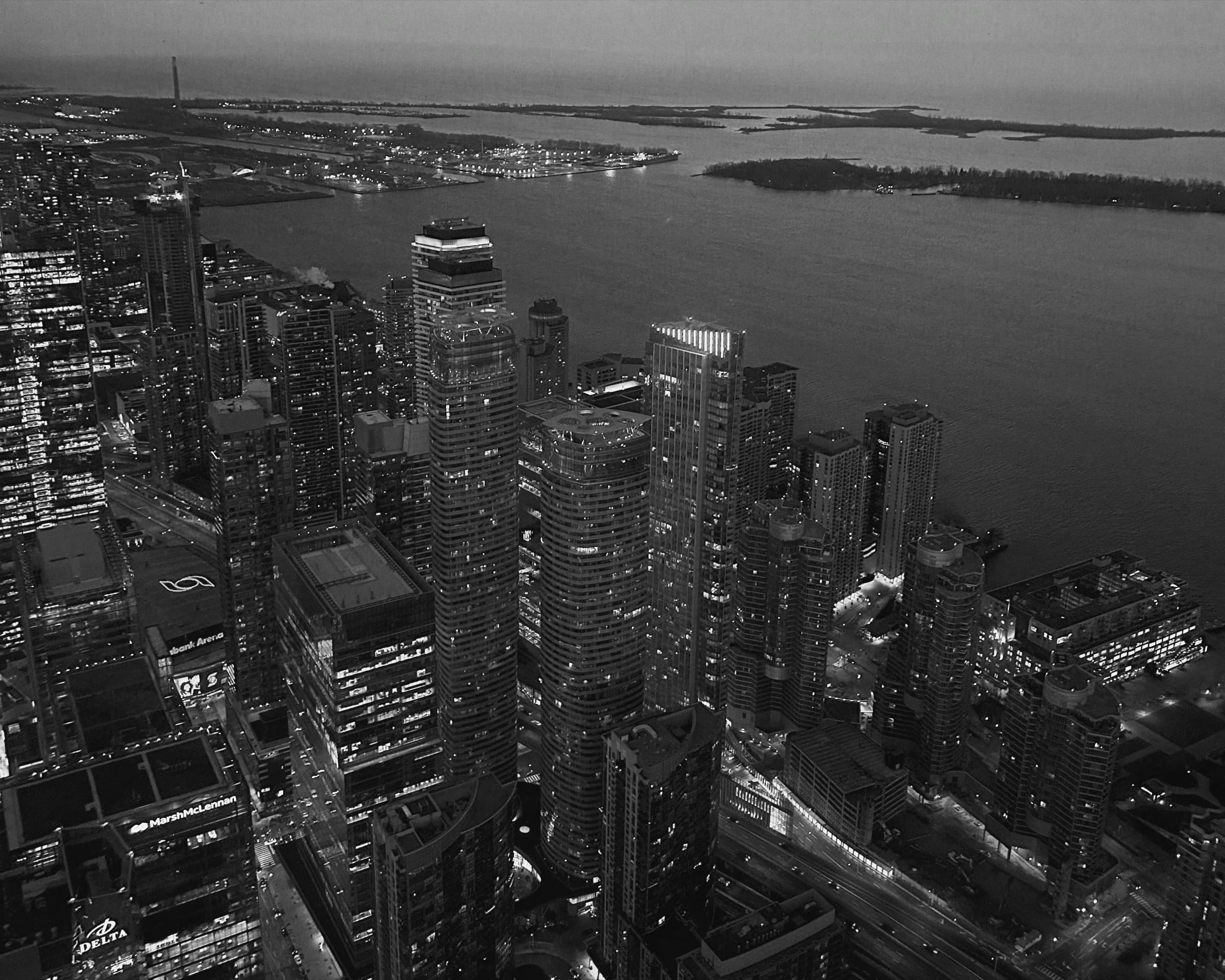 Aerial view of downtown Toronto and the lakeshore at dusk